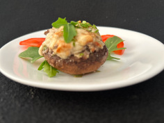 stuffed mushroom on a white sacer