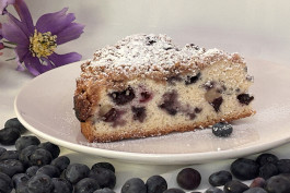 Blueberry Crumble Cake on a white sacer